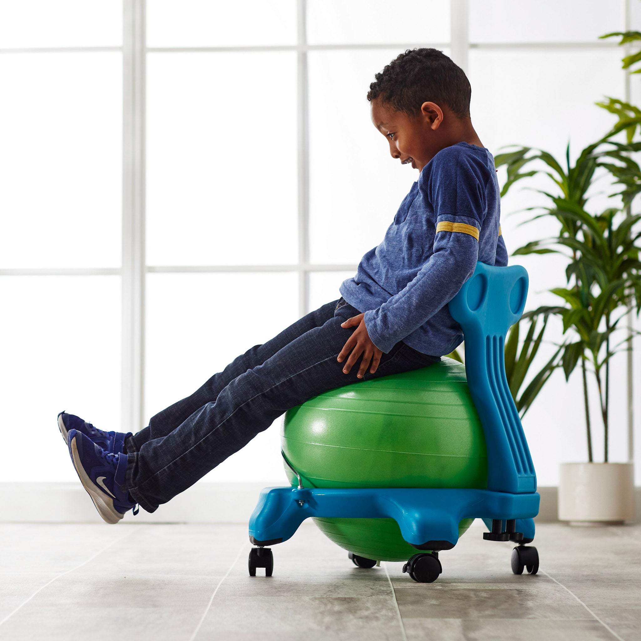 Kid sitting on Kids Classic Balance Ball Chair